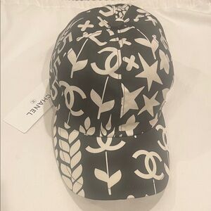 CHANEL 22P Black Baseball Cap with White Logo & Motif Print.